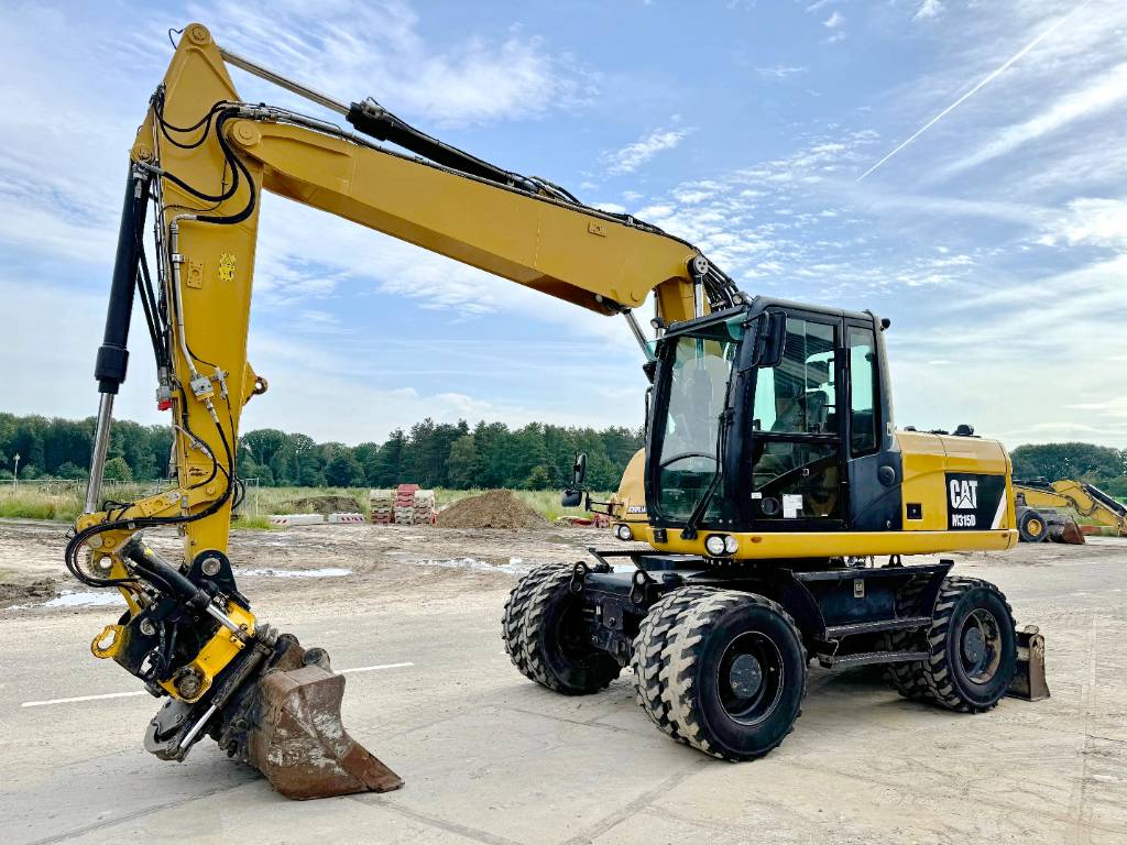 CAT M315D - 360° Engcon Rotating Bucket + Grapple