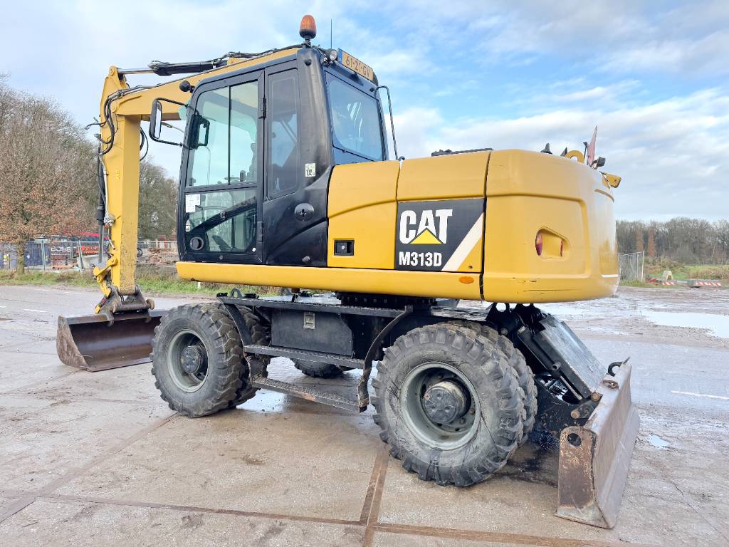 CAT M313D - Dutch Machine / Ride Control