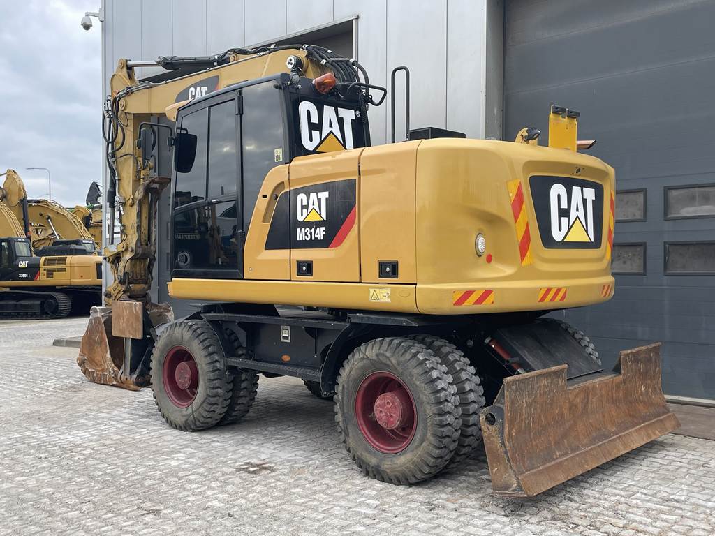 CAT M314F with Outriggers