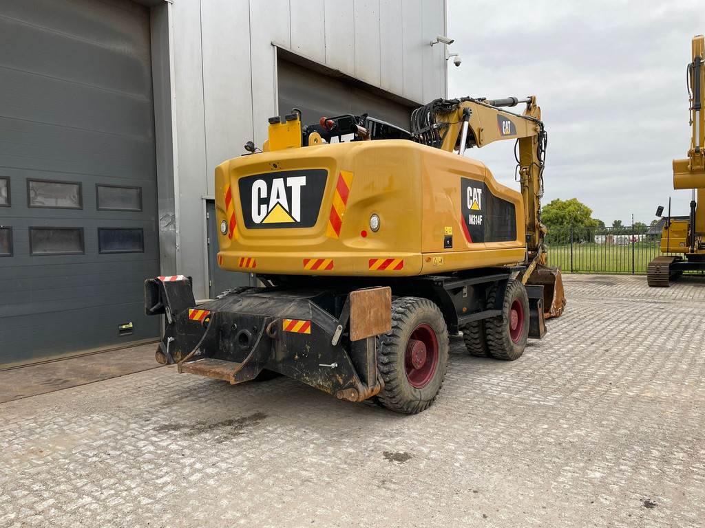 CAT M314F with Outriggers