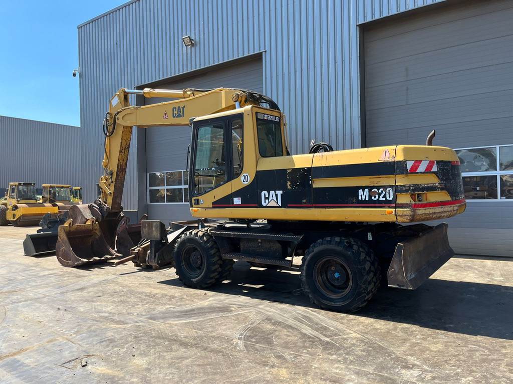 CAT M320 complete with 4 buckets and hammer available